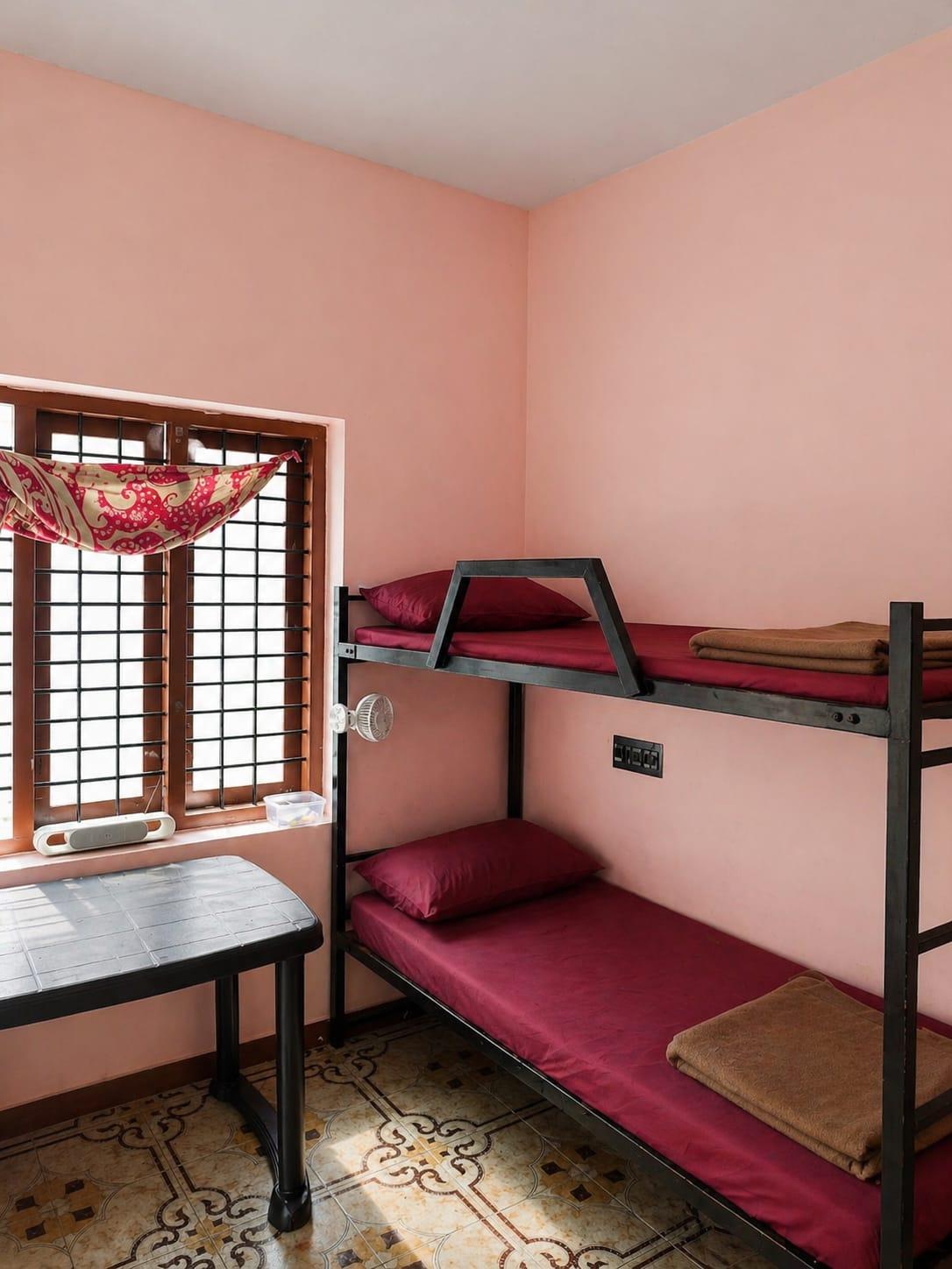 Clean shared dormitory room with bunk beds at Hive Gents PG Kakkanad