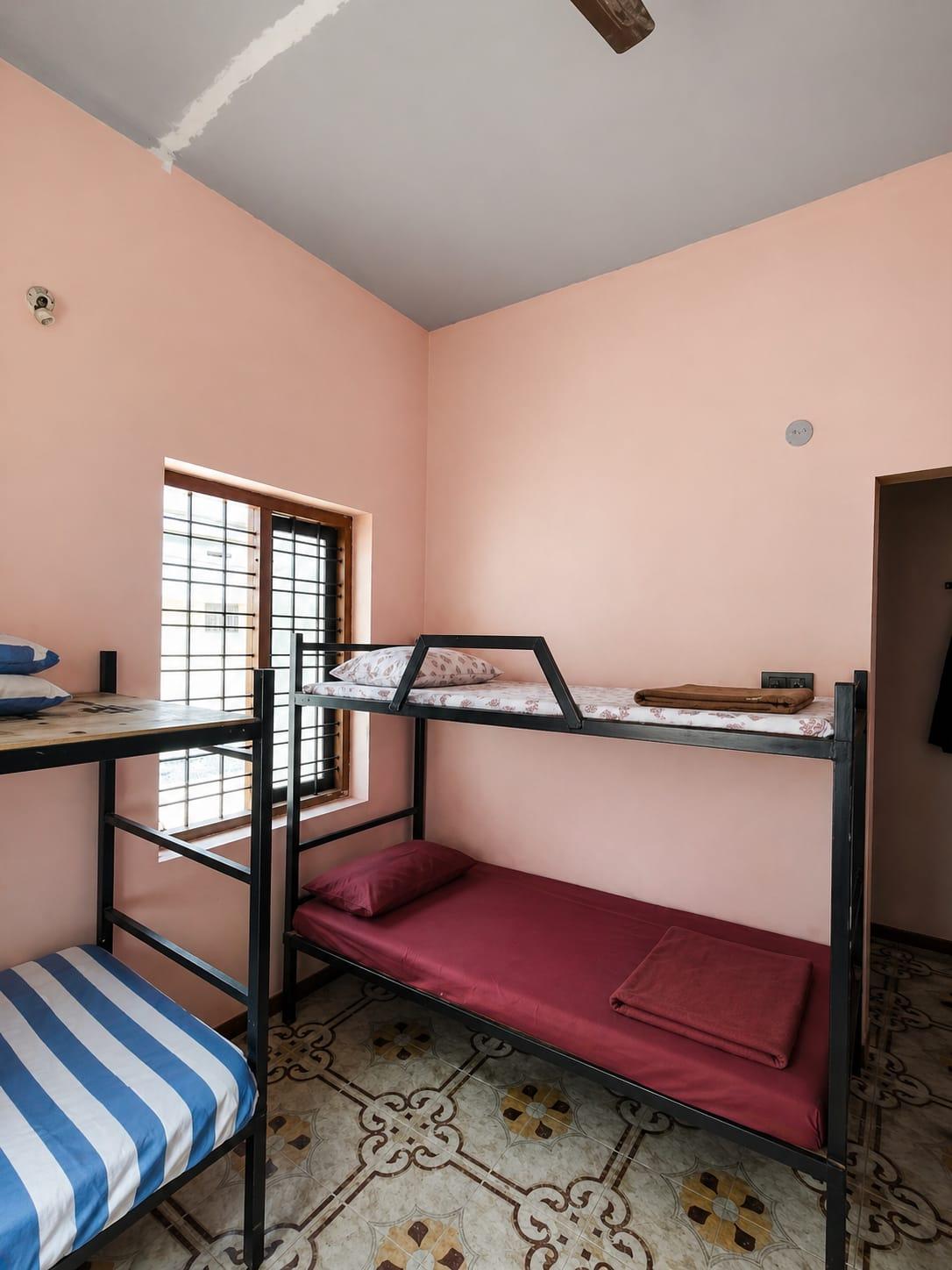 Bunk bed sharing room with natural light at Hive Gents PG