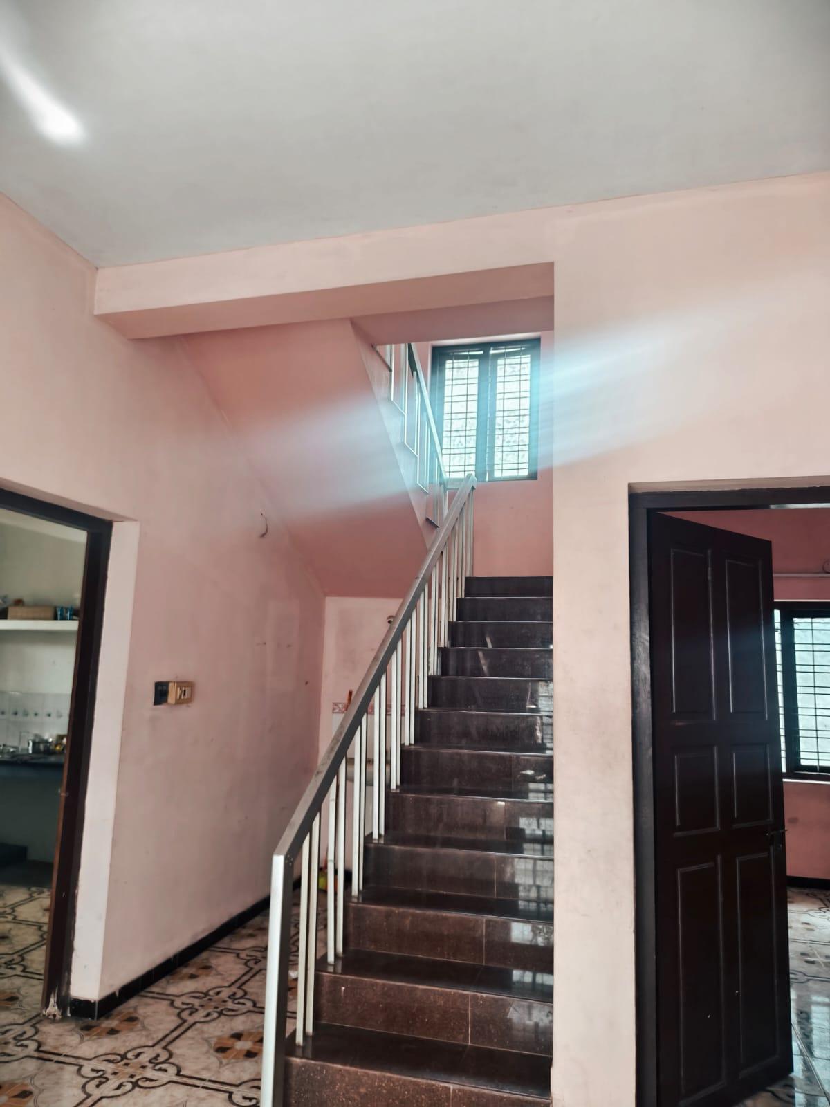 Bright interior hallway and staircase at Hive Gents PG